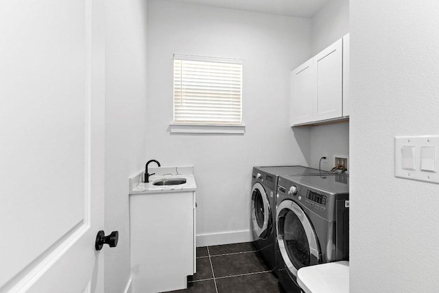 101 Saddle Mtn, Boerne, TX 78006 - laundry room featuring cabinet space, independent washer and dryer, dark tile patterned floors, and baseboards