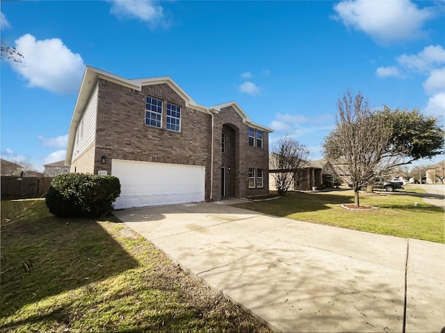 traditional home with a garage, a front yard, brick siding, and driveway