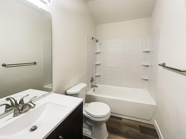 full bathroom featuring vanity, bathtub / shower combination, wood finished floors, and toilet