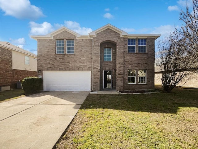 traditional home with a garage, a front yard, concrete driveway, and brick siding