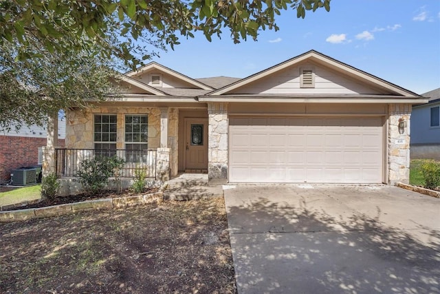 ranch-style house with a garage, cooling unit, stone siding, and driveway