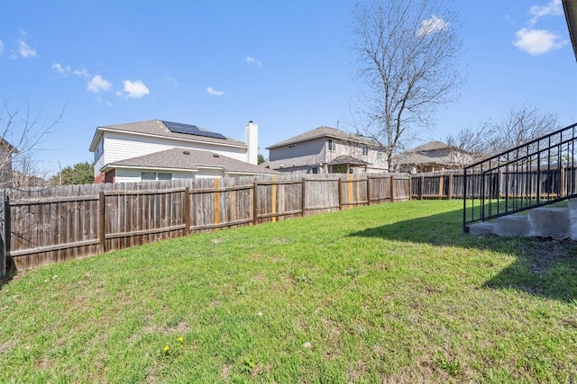 view of yard with a fenced backyard