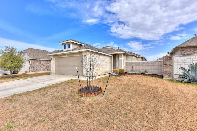 view of front of home with driveway, fence, and a front lawn