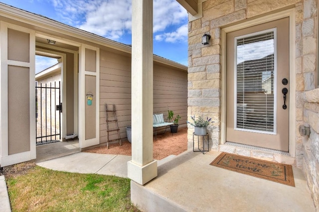 view of exterior entry featuring stone siding