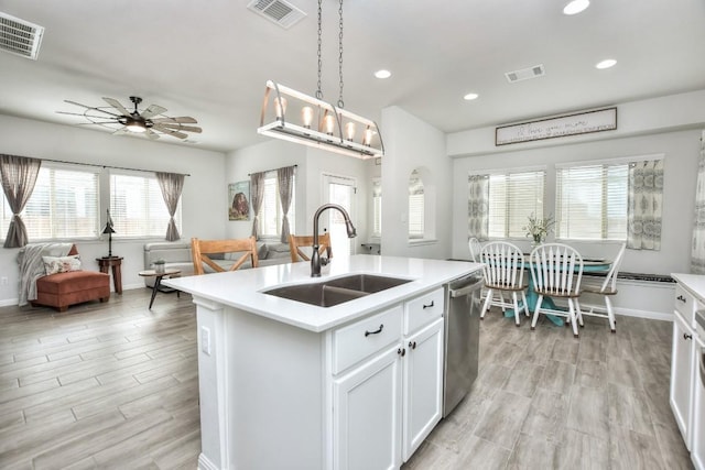 kitchen with visible vents, a sink, and stainless steel dishwasher