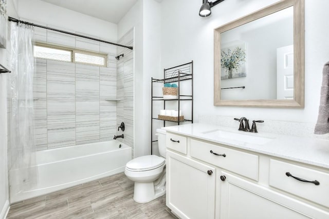 bathroom with toilet, shower / bath combo, wood finished floors, and vanity