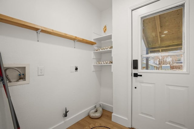 laundry room featuring hookup for a washing machine, hookup for an electric dryer, laundry area, wood finished floors, and baseboards