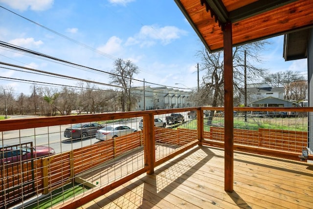 wooden terrace with a residential view