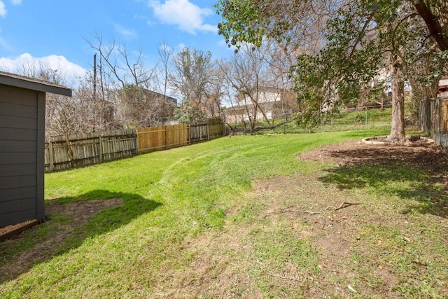 view of yard featuring a fenced backyard