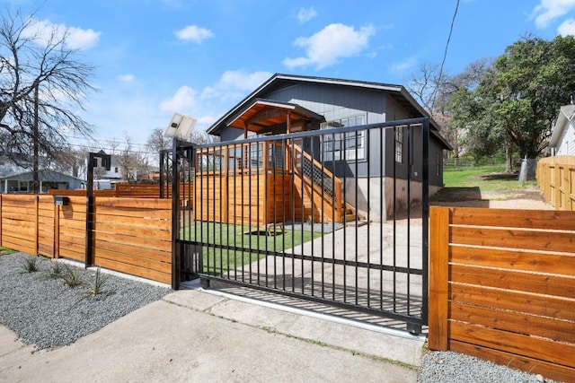 view of gate featuring a fenced front yard