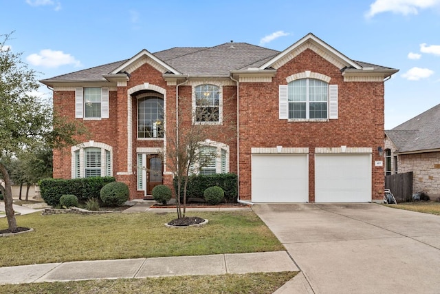 colonial-style house with a garage, concrete driveway, brick siding, and a front lawn