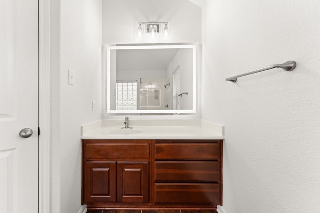 full bathroom with vanity and walk in shower