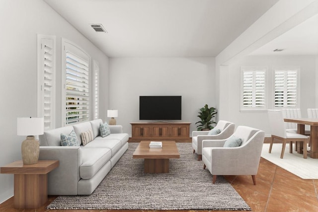 living room with visible vents and a wealth of natural light