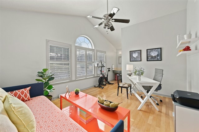 office area featuring ceiling fan, high vaulted ceiling, and wood finished floors