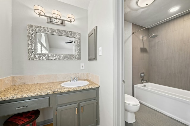 bathroom with toilet, washtub / shower combination, and vanity