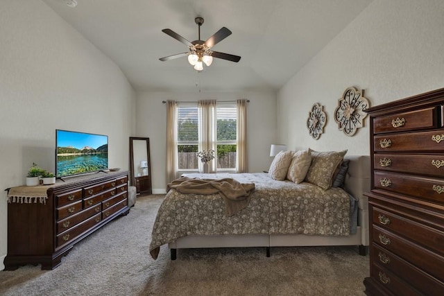 carpeted bedroom featuring vaulted ceiling and a ceiling fan