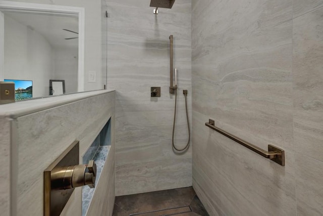 full bathroom featuring a marble finish shower, tile walls, and tile patterned floors