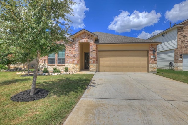 view of front of home with roof with shingles, concrete driveway, an attached garage, a front yard, and stone siding