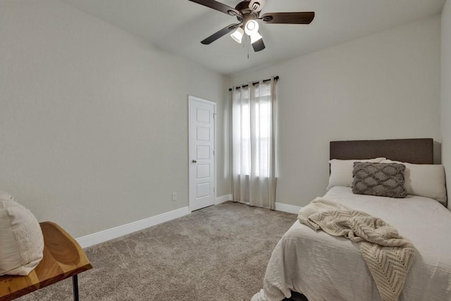 bedroom with light carpet, a ceiling fan, and baseboards