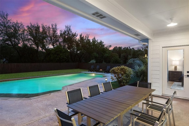 view of swimming pool featuring a patio area, a fenced backyard, outdoor dining area, and a fenced in pool