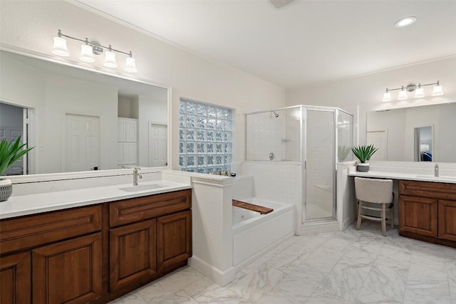 full bathroom featuring marble finish floor, vanity, a garden tub, and a stall shower