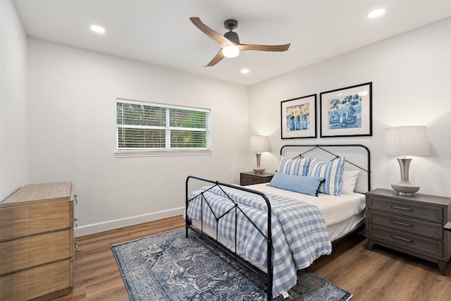 bedroom featuring recessed lighting, ceiling fan, baseboards, and wood finished floors