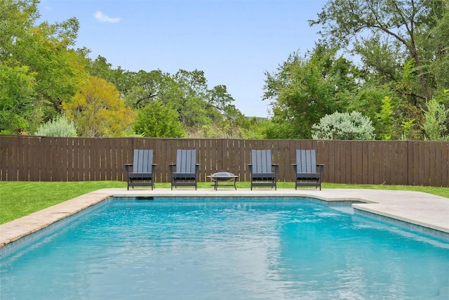 view of pool with a fenced in pool and fence