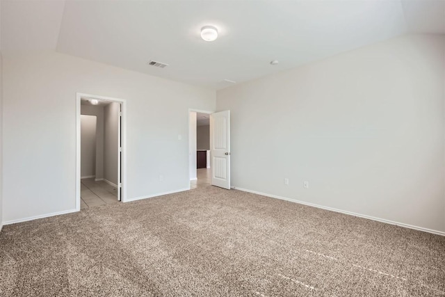 unfurnished bedroom with light carpet, baseboards, and visible vents