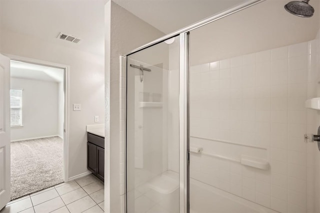 bathroom featuring a shower stall, visible vents, tile patterned flooring, and vanity