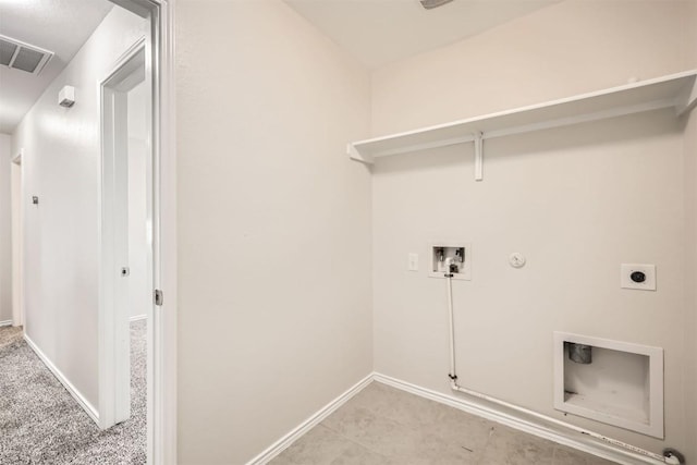 clothes washing area with laundry area, visible vents, hookup for a gas dryer, hookup for an electric dryer, and washer hookup