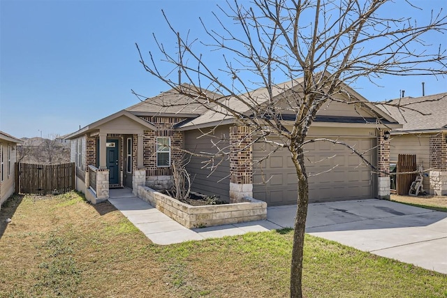 view of front of house featuring concrete driveway, an attached garage, fence, a front lawn, and brick siding