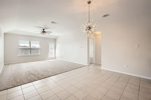 empty room with light colored carpet, visible vents, baseboards, and ceiling fan with notable chandelier