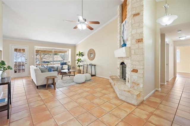 living room featuring light tile patterned floors, ornamental molding, a stone fireplace, high vaulted ceiling, and baseboards