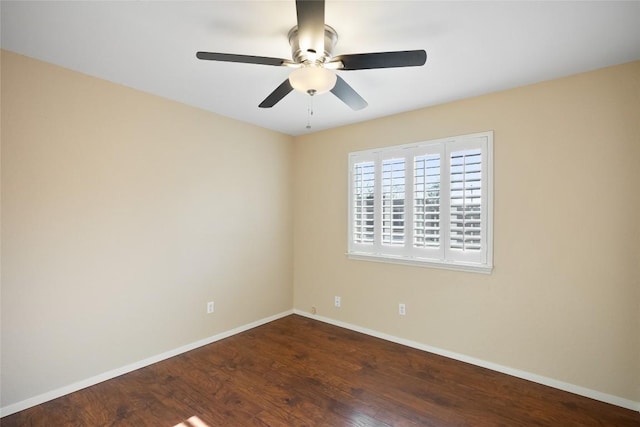 spare room with a ceiling fan, baseboards, and wood finished floors