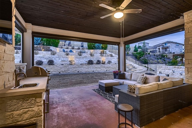 view of patio / terrace with ceiling fan, an outdoor hangout area, area for grilling, a sink, and stairs