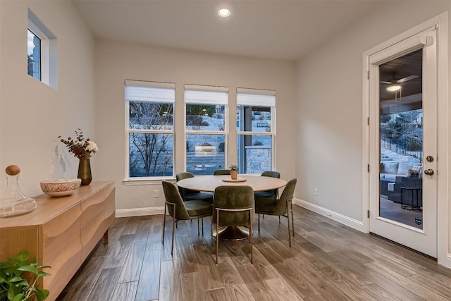 dining area featuring baseboards, dark wood-style flooring, and recessed lighting