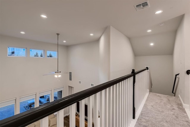 hall with visible vents, carpet floors, an upstairs landing, and recessed lighting