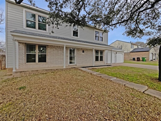 1602 Wildwood Dr, Round Rock, TX 78681 - traditional-style house featuring brick siding, driveway, a front lawn, and roof with shingles