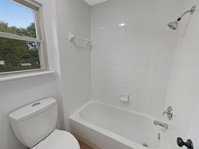 bathroom with shower / bath combination and toilet