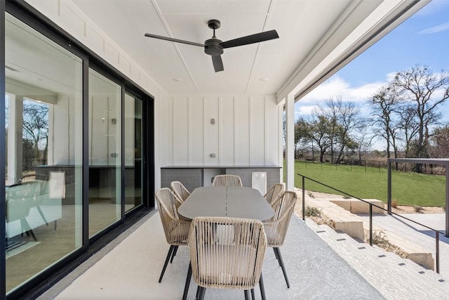 sunroom / solarium featuring a ceiling fan and a healthy amount of sunlight