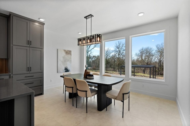 dining space with recessed lighting, baseboards, and light tile patterned floors