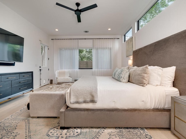 bedroom featuring recessed lighting, visible vents, ceiling fan, and light wood-style flooring