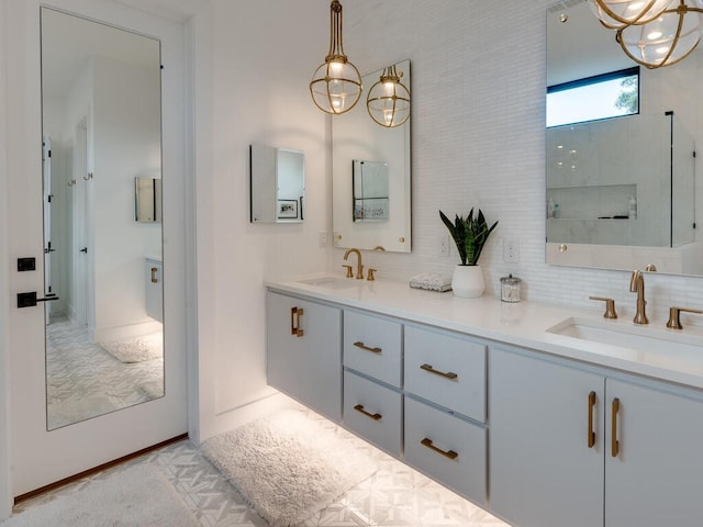 bathroom featuring a sink, backsplash, and double vanity