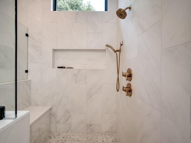 bathroom featuring tiled shower