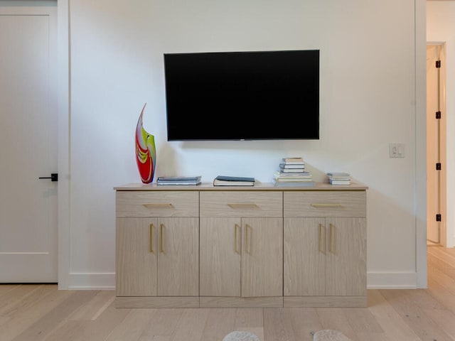 interior details with wood finished floors and baseboards