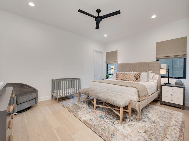 bedroom featuring light wood-style floors, recessed lighting, baseboards, and a ceiling fan