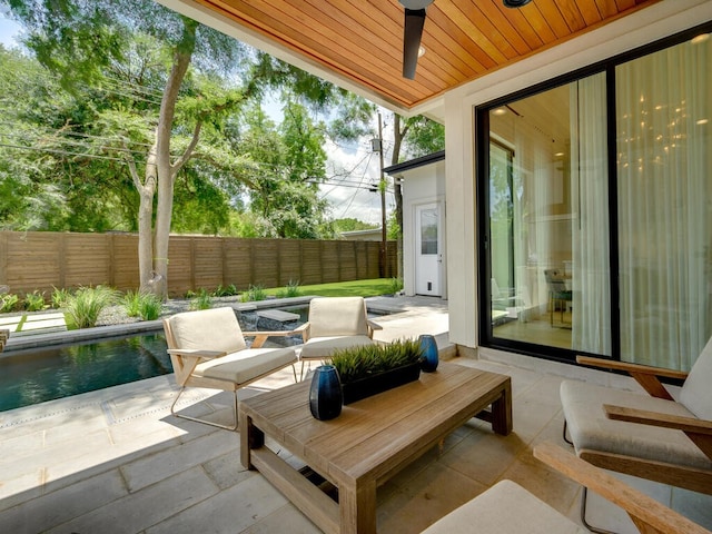 view of patio featuring a ceiling fan and a fenced backyard