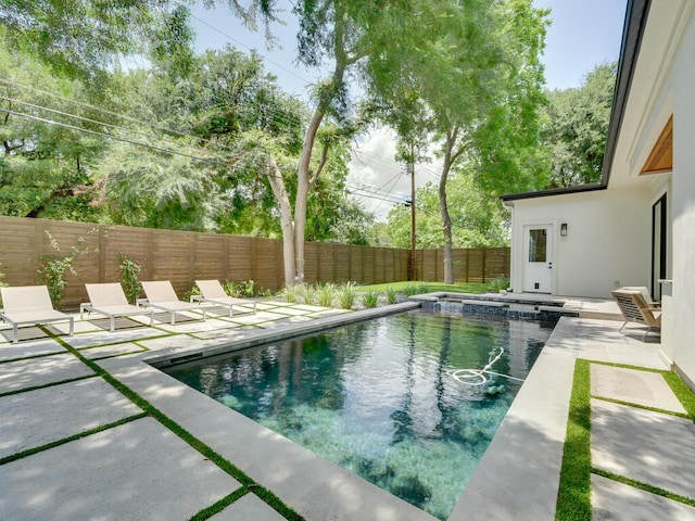 view of swimming pool with a patio, a fenced backyard, and a fenced in pool