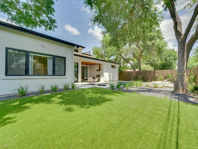 view of yard featuring a patio area and fence