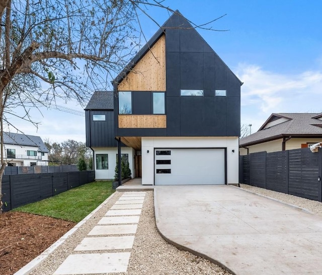 contemporary house with fence and driveway